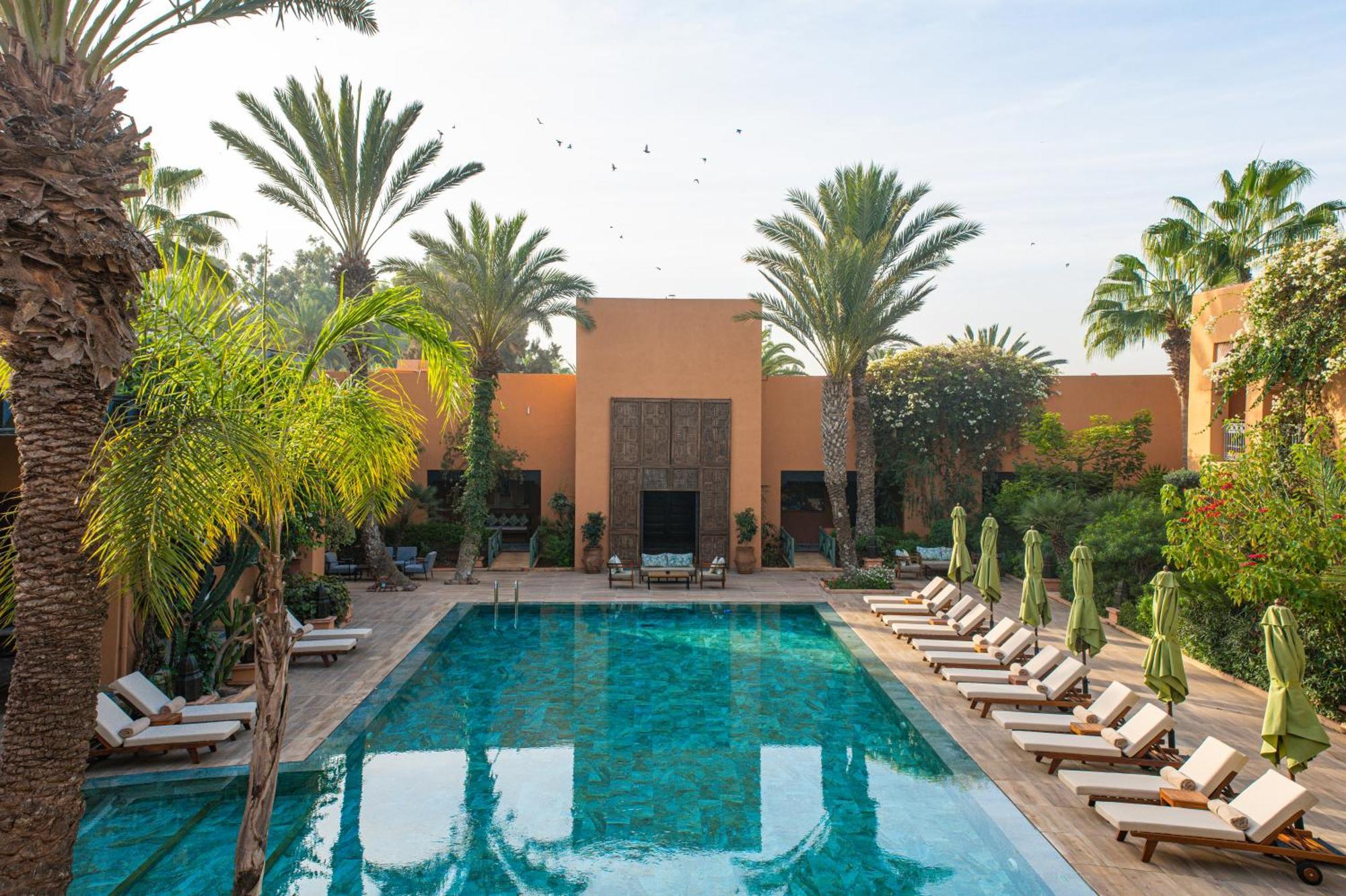 티키다 골프 팰리스 렐레 앤 샤토 호텔 아가디르 외부 사진 The swimming pool at the Ouarzazate hotel